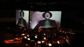 Photograph of Batman concert featuring on stage screens and orchestra