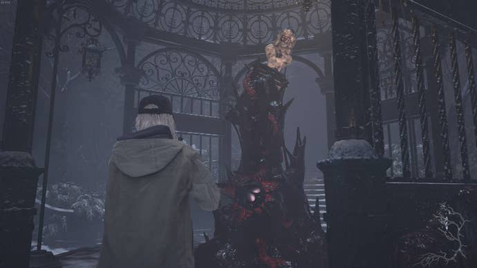 Rose Winters looks up at a bust wearing the bronze mask in Resident Evil Village's Shadows of Rose DLC