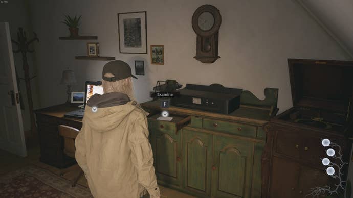 Rose Winters looks at a chest of drawers in the Winters home in Resident Evil Village's Shadows of Rose DLC