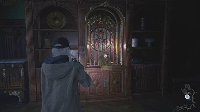 Rose looks at the shotgun locked away by the triocular key in Resident Evil Village's Shadows of Rose DLC