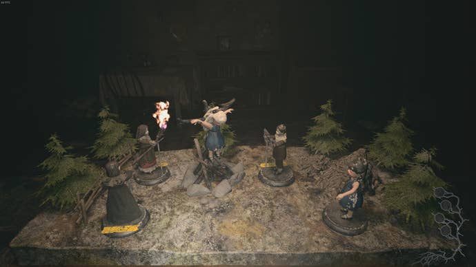 Dolls are placed on the workshop table in Beneviento House in Resident Evil Village's Shadows of Rose DLC