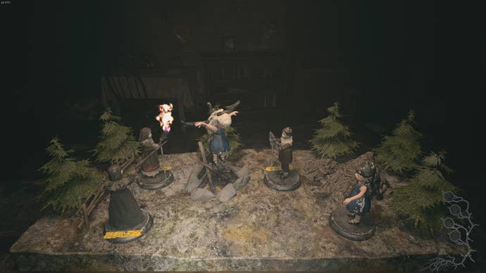 Dolls are placed on the workshop table in Beneviento House in Resident Evil Village's Shadows of Rose DLC