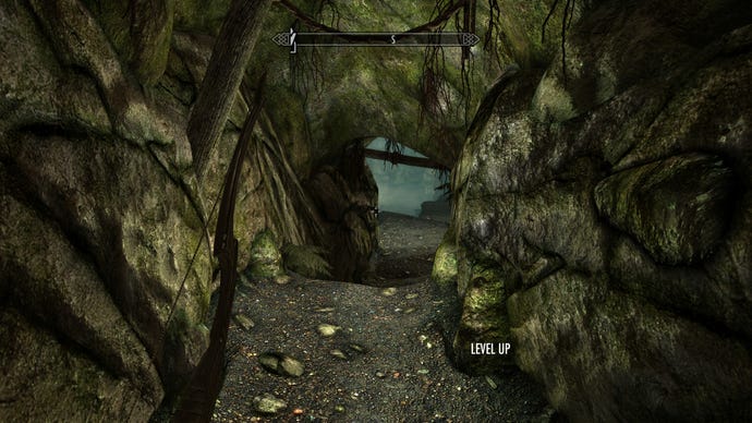 A narrow cave corridor in Skyrim