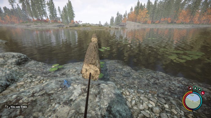A player uses a zipline to move logs across a lake in Sons of the Forest.