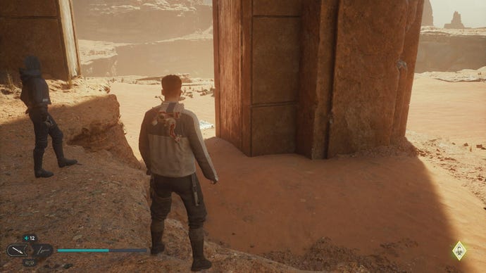 Star Wars Jedi Survivor screenshot showing Cal and Merrin stood near a pillar in the desert.