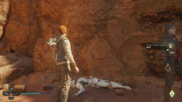 Star Wars Jedi Survivor screenshot showing Cal staring at a stormtrooper corpse on Jedha, with Merrin stood nearby.