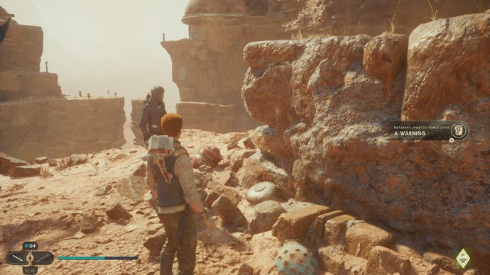 Star Wars Jedi Survivor screenshot showing Cal staring at a scan point on some craggy desert rocks.