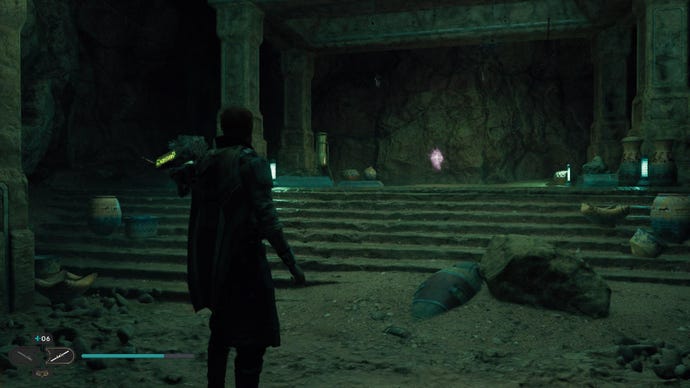 Star Wars Jedi: Survivor screenshot showing Cal stood in a dark room, dimly lit with a green hue. There's a crackling orb hovering in the air up ahead.