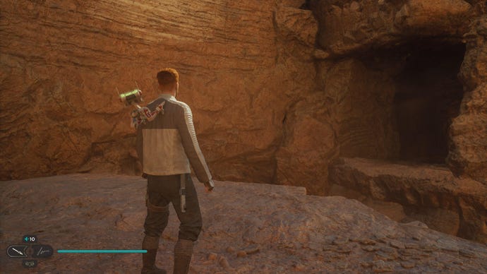 Star Wars Jedi: Survivor screenshot showing Cal staring at a rocky wall in the desert.