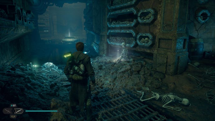 Star Wars Jedi: Survivor screenshot showing Cal stood in a catacomb, with skeletons and bones in holes on the wall and scattered on the floor.