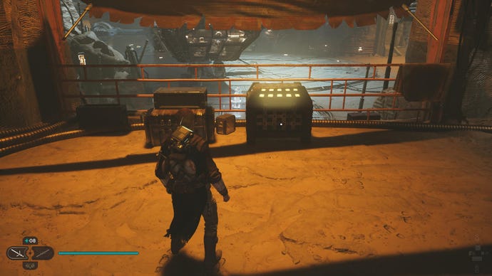 Star Wars Jedi Survivor screenshot showing Cal near a chest in the hangar of Cere's Base.