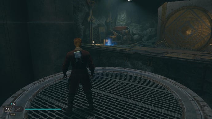 Star Wars Jedi Survivor screenshot showing Cal stood near a Force Echo scan point in a dark cave.