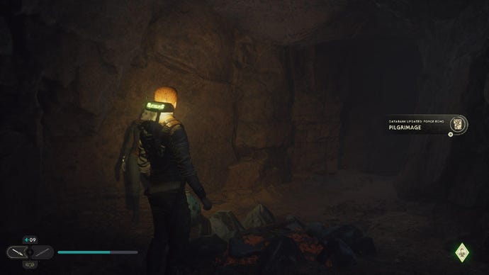 Star Wars Jedi Survivor screenshot showing Cal in a dark room, dimly lit by BD-1.