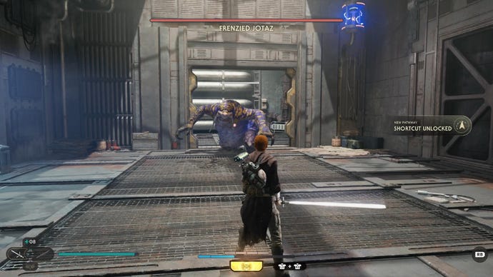 Star Wars Jedi Survivor Screenshot zeigt, wie Cal den rasenden Jotaz mit einem an seiner Seite gezogenen Lichtschwert gegenübersteht