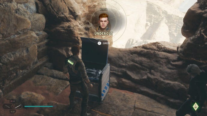 Star Wars Jedi Survivor screenshot showing Cal stood near a chest on a rocky edge of some ruins in the Halls of Ranvell.