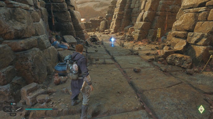 Star Wars Jedi Survivor screenshot showing Cal staring at an Essence in the sandy ruins of Jedha.