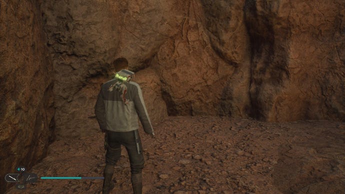Star Wars Jedi Survivor screenshot showing Cal stood on a rocky ledge.
