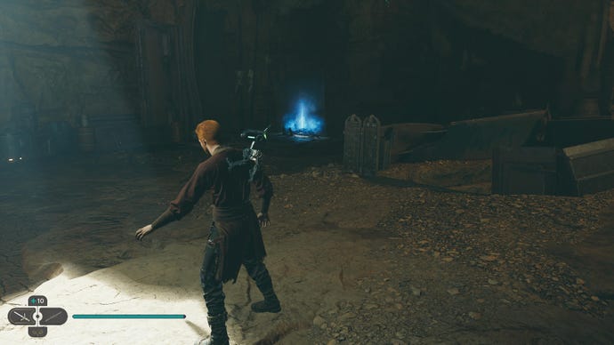 Star Wars Jedi Survivor screenshot showing Cal stood in a cave near a blue glow.