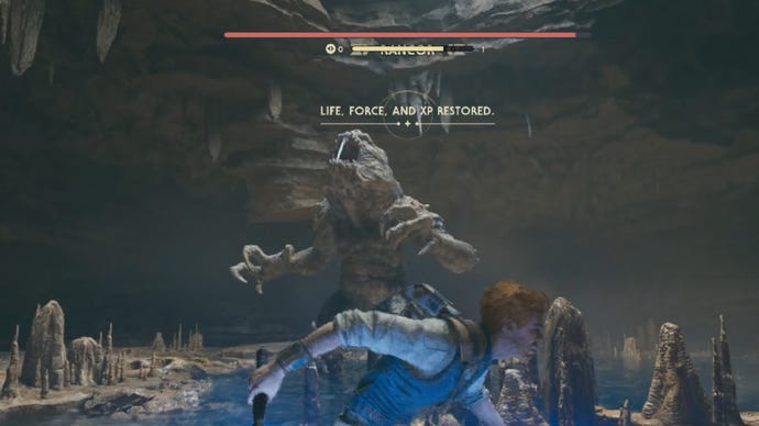 Star Wars Jedi Survivor screenshot showing Cal running as a Rancor staggers with a bone in its mouth.