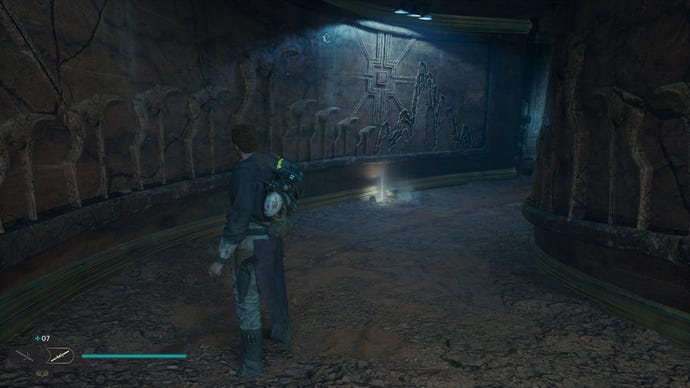 Star Wars Jedi: Survivor screenshot showing Cal stood in an underground tunnel, with a bright blue glow up ahead.