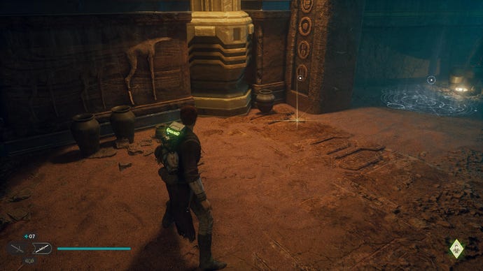 Star Wars Jedi: Survivor screenshot showing Cal stood in a desert cave tunnel, staring at a glinting treasure on the floor.