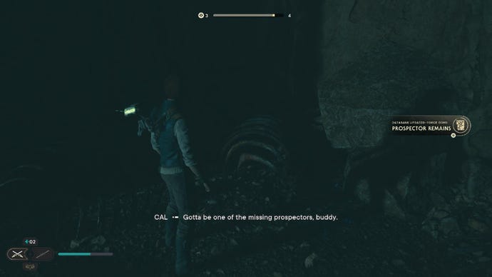 Star Wars Jedi Survivor screenshot showing Cal stood near some bloodied bones in a dark cave.