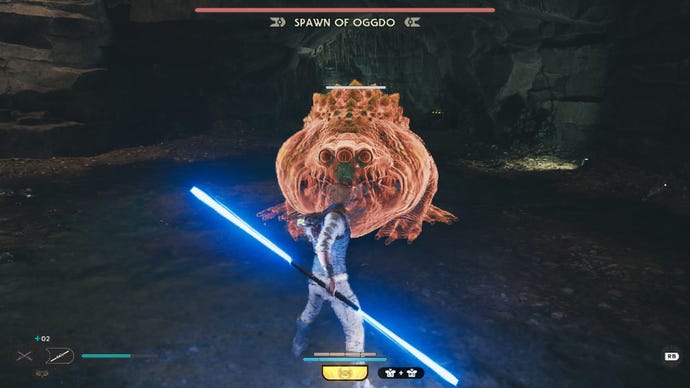 Star Wars Jedi Survivor screenshot showing Cal wielding a double-bladed lightsaber, facing the Spawn of Oggdo as it glows red.