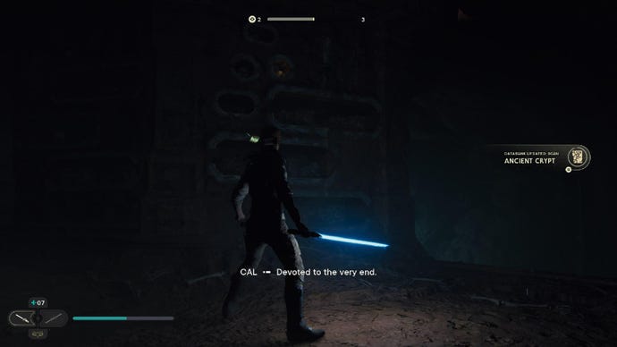 Star Wars Jedi: Survivor screenshot showing Cal holding a single blue lightsaber in a dark cave.