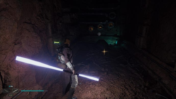 Star Wars Jedi: Survivor screenshot showing Cal wielding a double-bladed lightsaber in a dark cave corridor, staring at a chest.