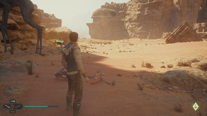 Star Wars Jedi Survivor screenshot showing Cal staring at a Jedha Scroll glint in the sand.