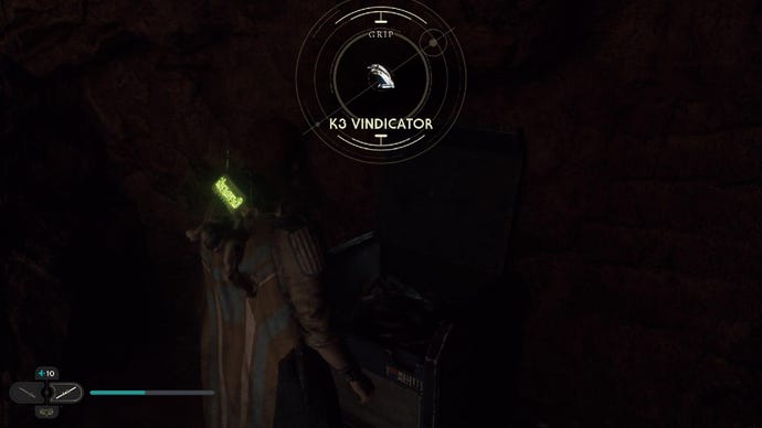Star Wars Jedi: Survivor screenshot showing Cal staring at a chest in a dark room.