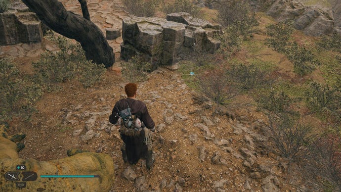 Star Wars Jedi Survivor screenshot showing Cal on grassy plains near a rock.