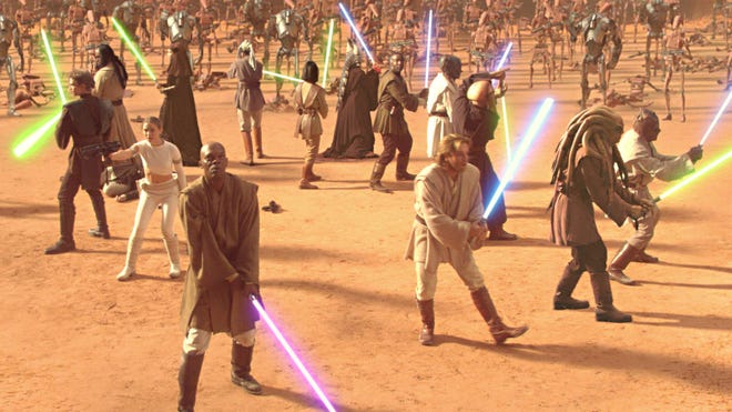 Star Wars Attack of the Clones Mace Windu, Obi-Wan Kenobi, Padme Amidala, and Anakin Skywalker holding their lightsabers.