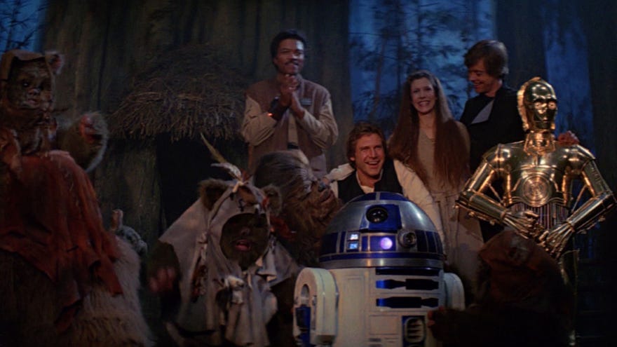 Star Wars Return of the Jedi, Han Solo, Princess Leia, Luke Skywalker, R2-D2, C-3PO, Lando, and Ewoks celebrating the destruction of the second Death Star on Endor