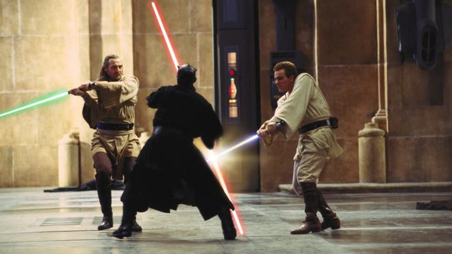 Star Wars The Phantom Menace, Liam Neeson as Qui-Gon Jinn and Ewan McGregor as Obi-Wan Kenobi battling Ray Park as Darth Maul