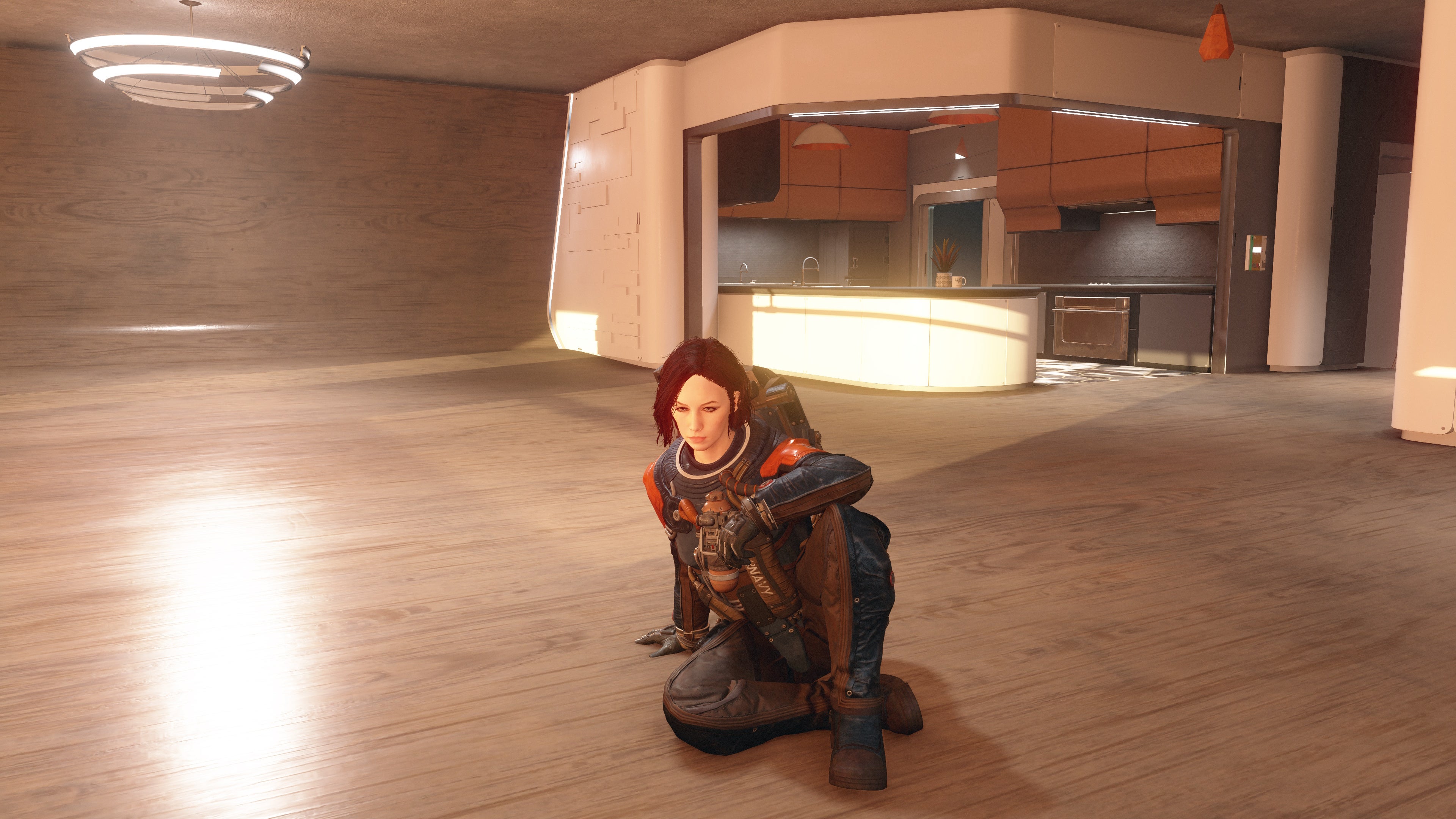 Vista en modo fotográfico de un personaje con armadura de vanguardia y sin casco sentado en el suelo de un ático vacío.