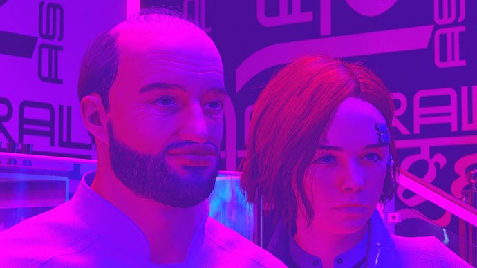 A balding man with a red-haired woman in Starfield