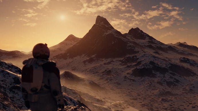 A solitary astronaut stares out at a snow covered mountain range as the sun sets behind it