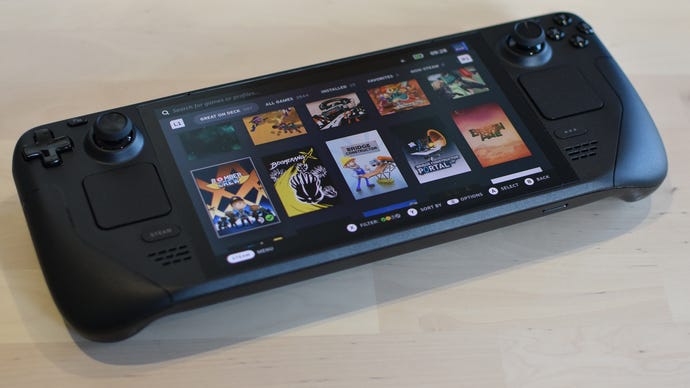 A Steam Deck OLED showing the Steam library screen.