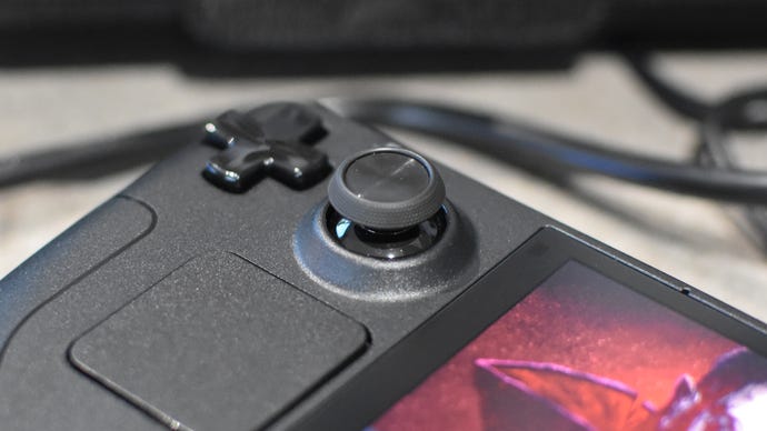 A close up of one of the redesigned thumbsticks on the Steam Deck OLED.