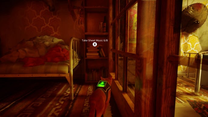 Stray screenshot showing a cat staring at a tall bookshelf next to a bed. There is a piece of sheet music on the bookshelf.
