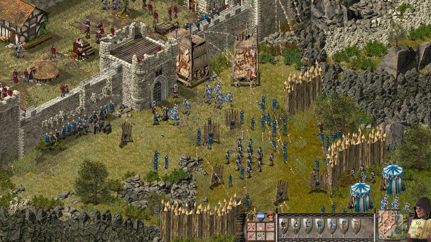 A castle under siege in a screenshot from Stronghold Definitive Edition