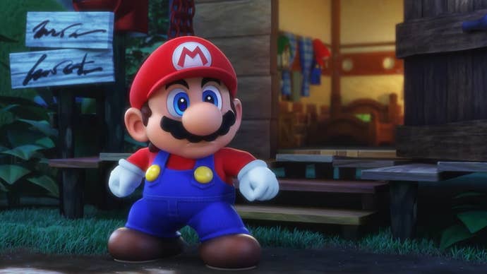 La versión pequeña y rechoncha de Mario se encuentra un poco preocupada frente a una casa bonita y acogedora y un cartel en una captura de pantalla del remake de Super Mario RPG.