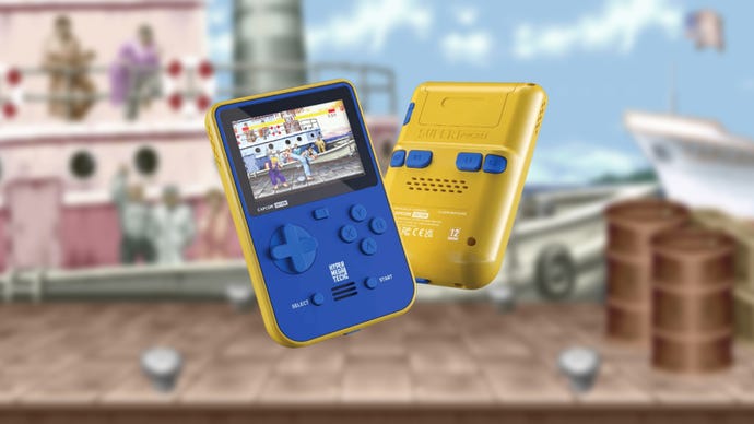 Super Pocket handheld machine in blue and yellow, on a backdrop of a slightly blurred Street Fighter 2 stage; a dockyard with ships in the background.