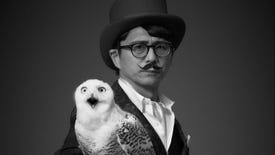 Game developer Swery with a white owl on his arm