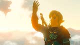 Link in the The Legend of Zelda: Tears of the Kingdom looking at his arm outstretched, with the character basked in the orange glow of a sunrise.