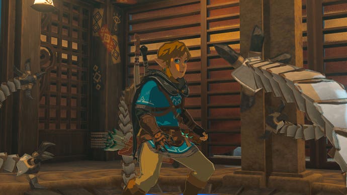 In-game image from The Legend of Zelda: Tears of the Kingdom showing Link looking surprised as a creature closes in on him.