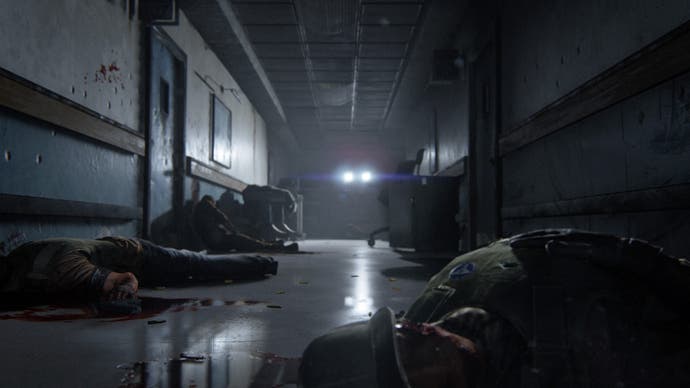 A distant light shines down what appears to be a hospital corridor. Corpses litter the ground.