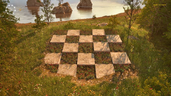 A giant chess board embedded in the grass