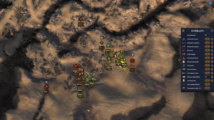 A sky-high view of a Total War: Pharaoh battle shows units clashing over a small settlement.